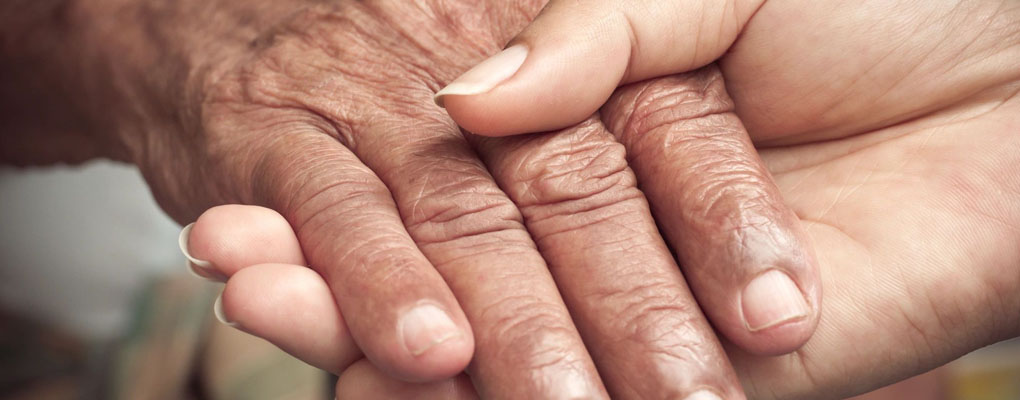 A close up of an old person 's hands
